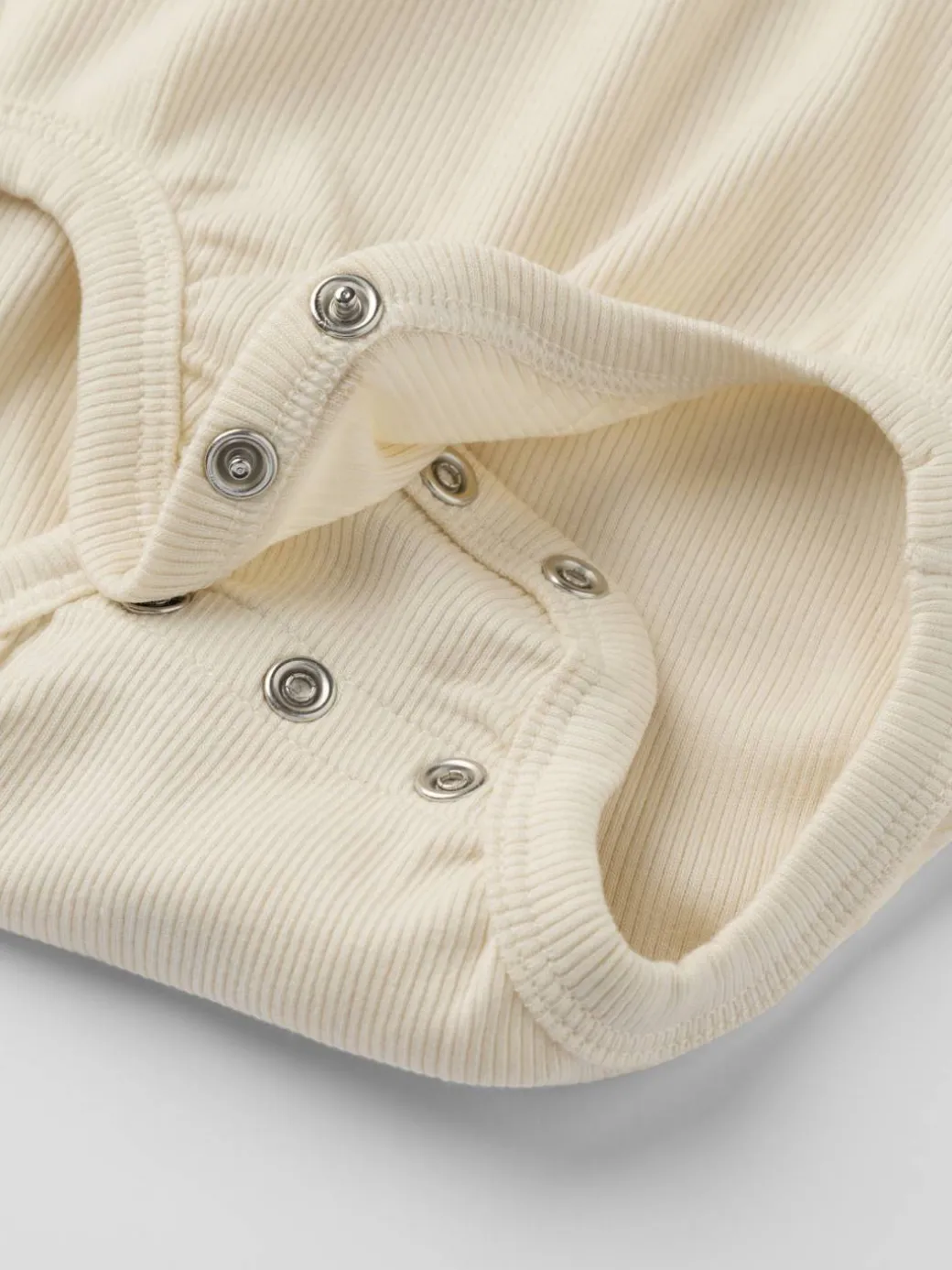 Forlengbar ribbestrikket body